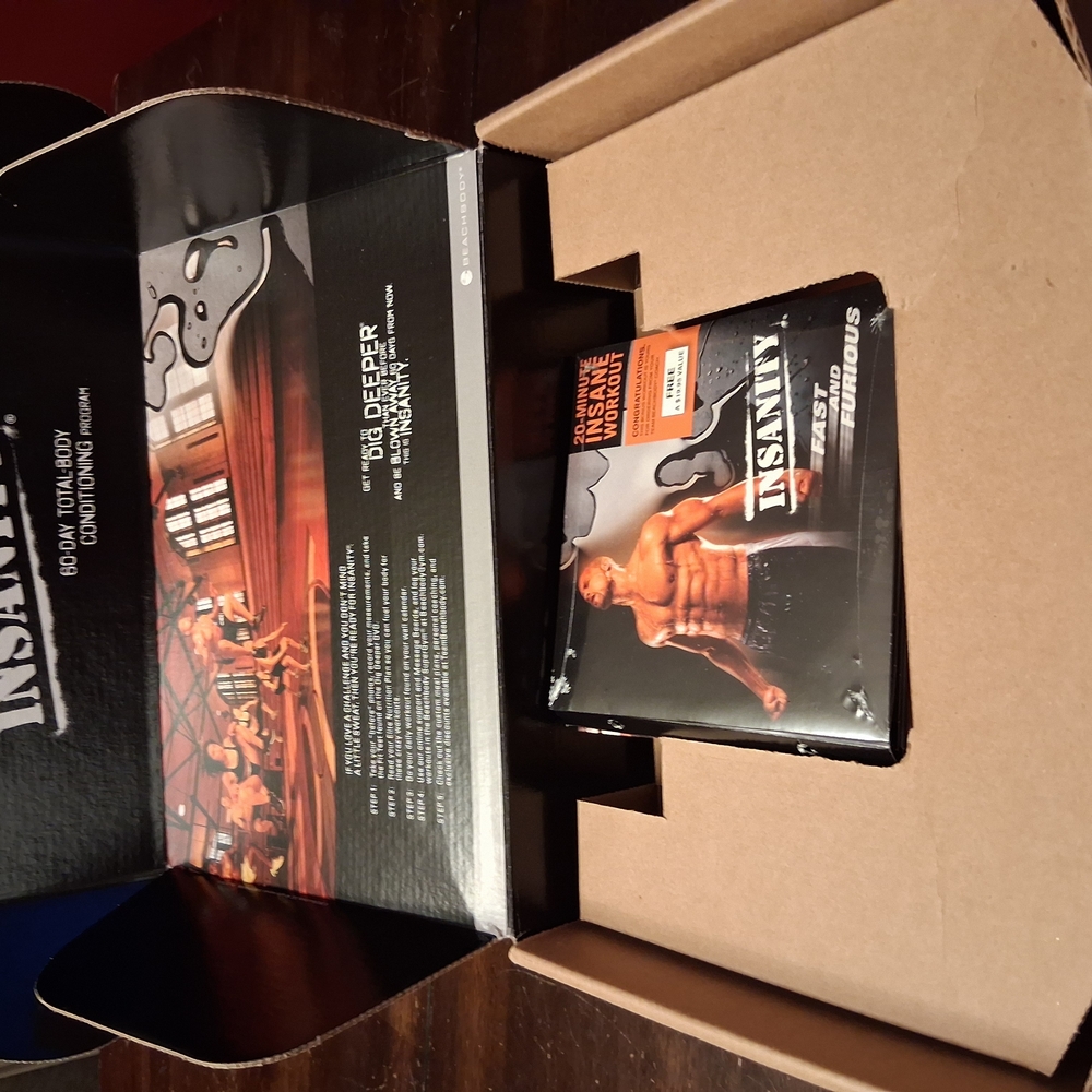 Beachbody Insanity Workout DVD Set - Black and Orange